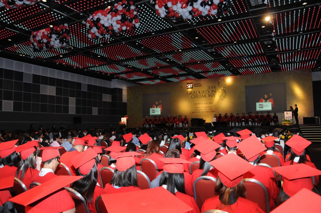 Students from the Technical University of Munich, in their red graduation gowns and caps listening to the opening address by guest of honour, Mr Heng Swee Keat, Minister for Education at the SIT Graduation Ceremony 2014 (16 March 2014). Photo | SIT
