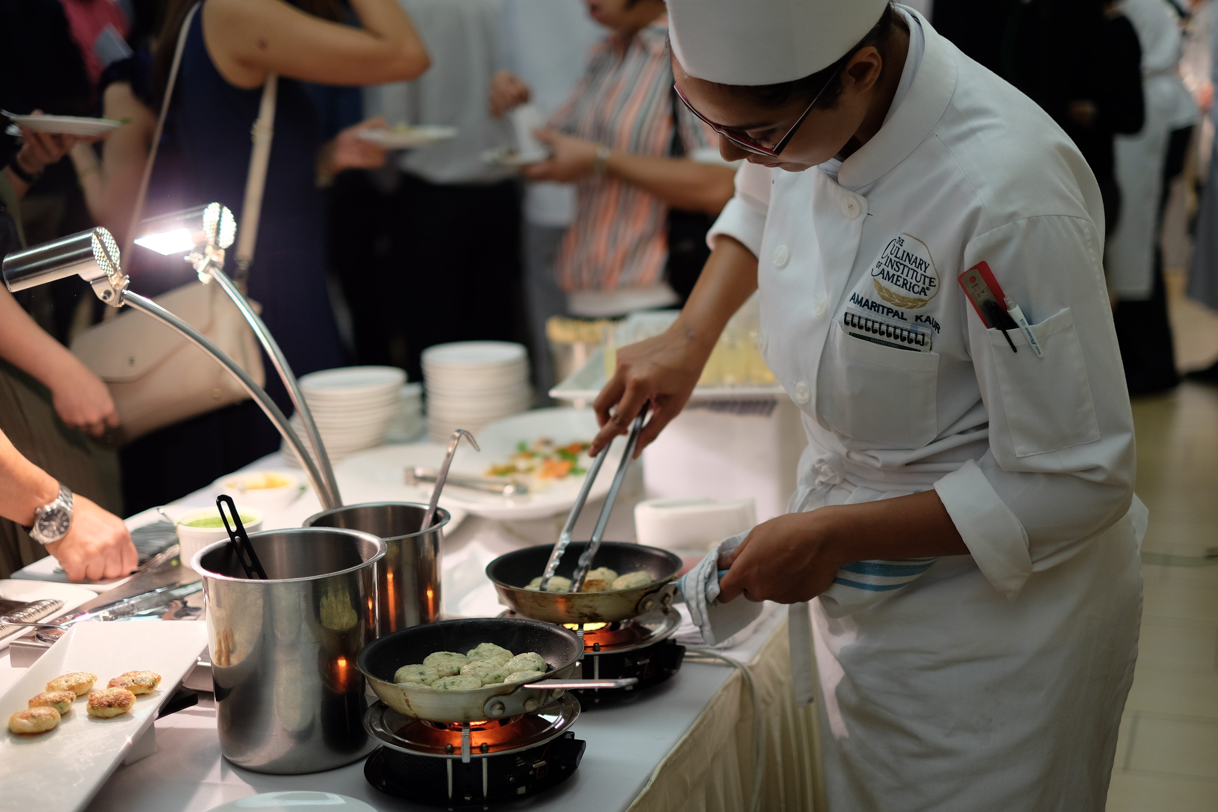 At the graduation banquet, junior culinarians prepare the food for guests and man the live stations.