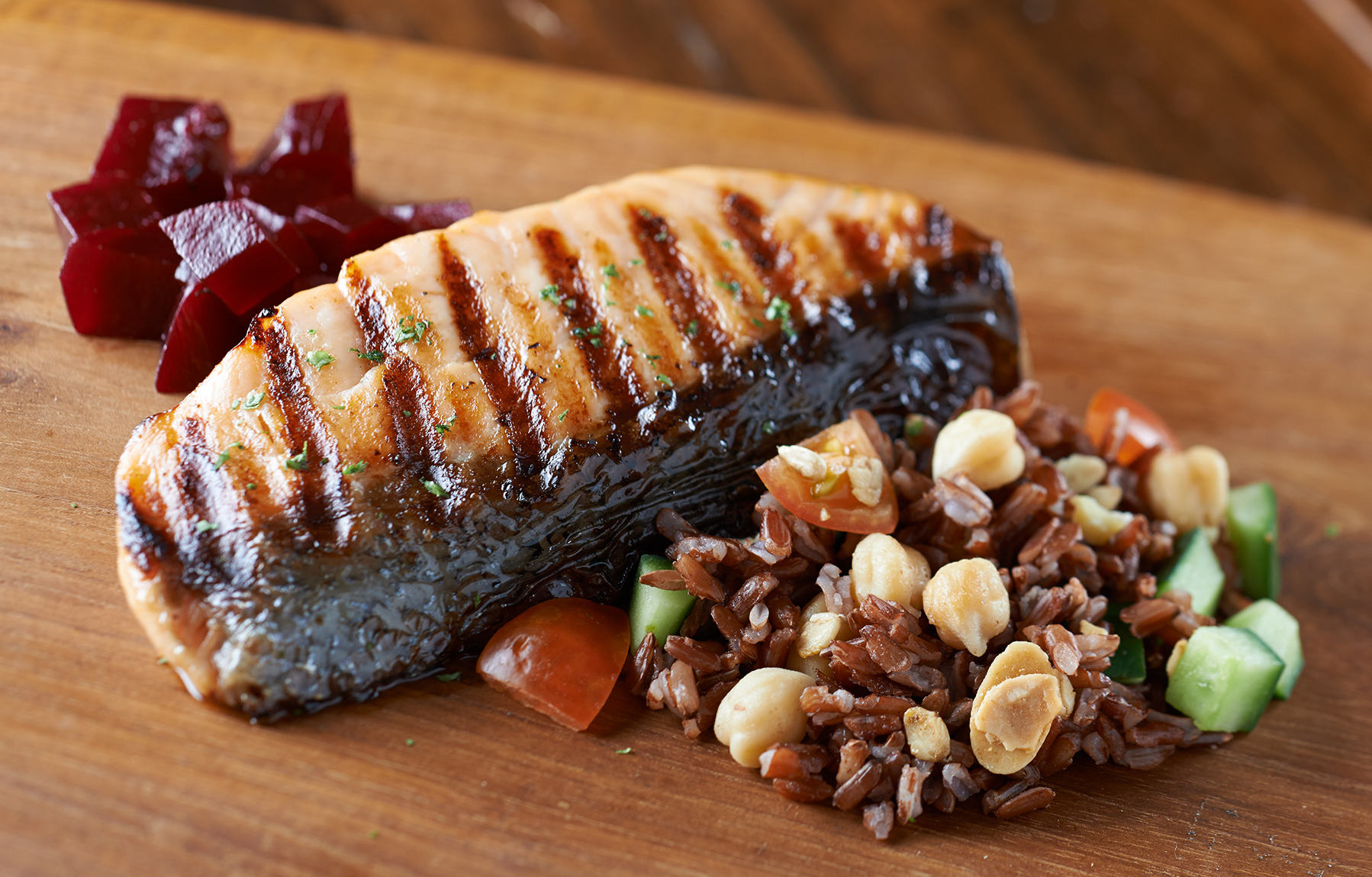 Hickory-smoked and grilled sashimi-grade salmon with forgotten grains.