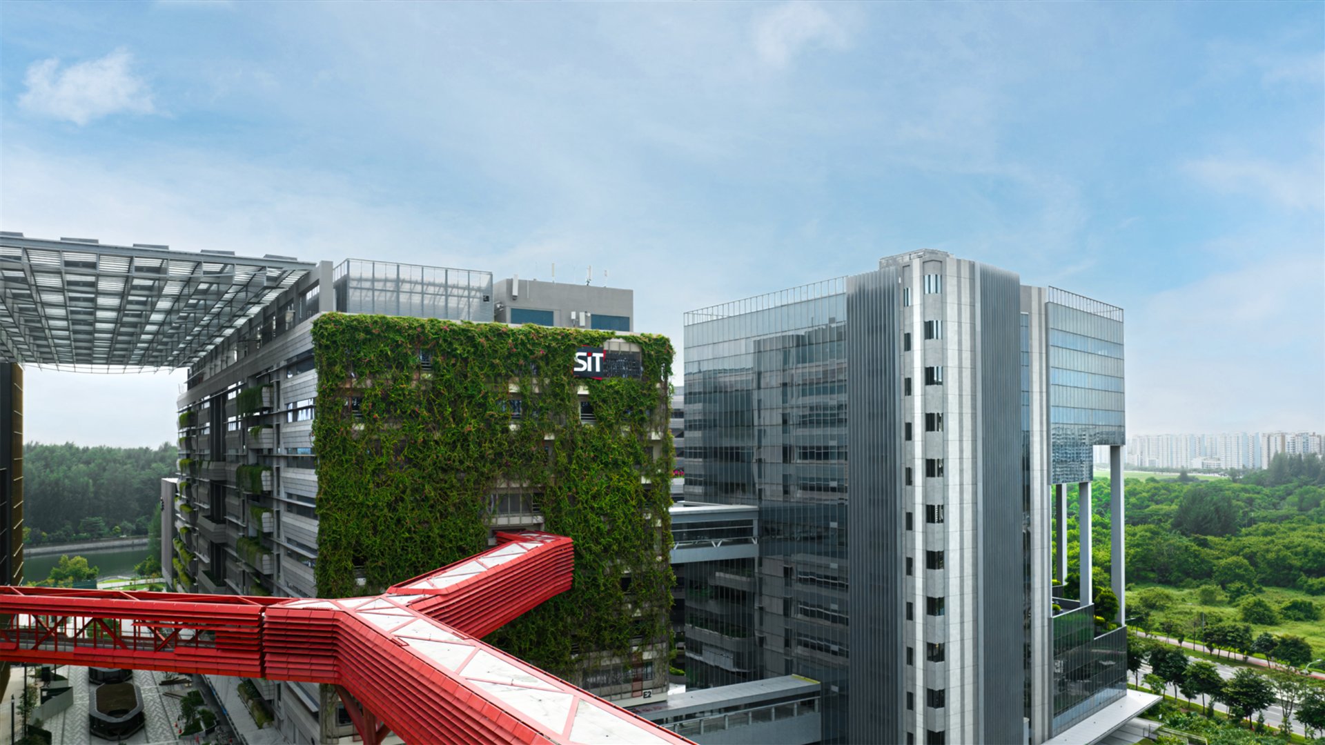 SIT Punggol Campus with its green facade and red bridge